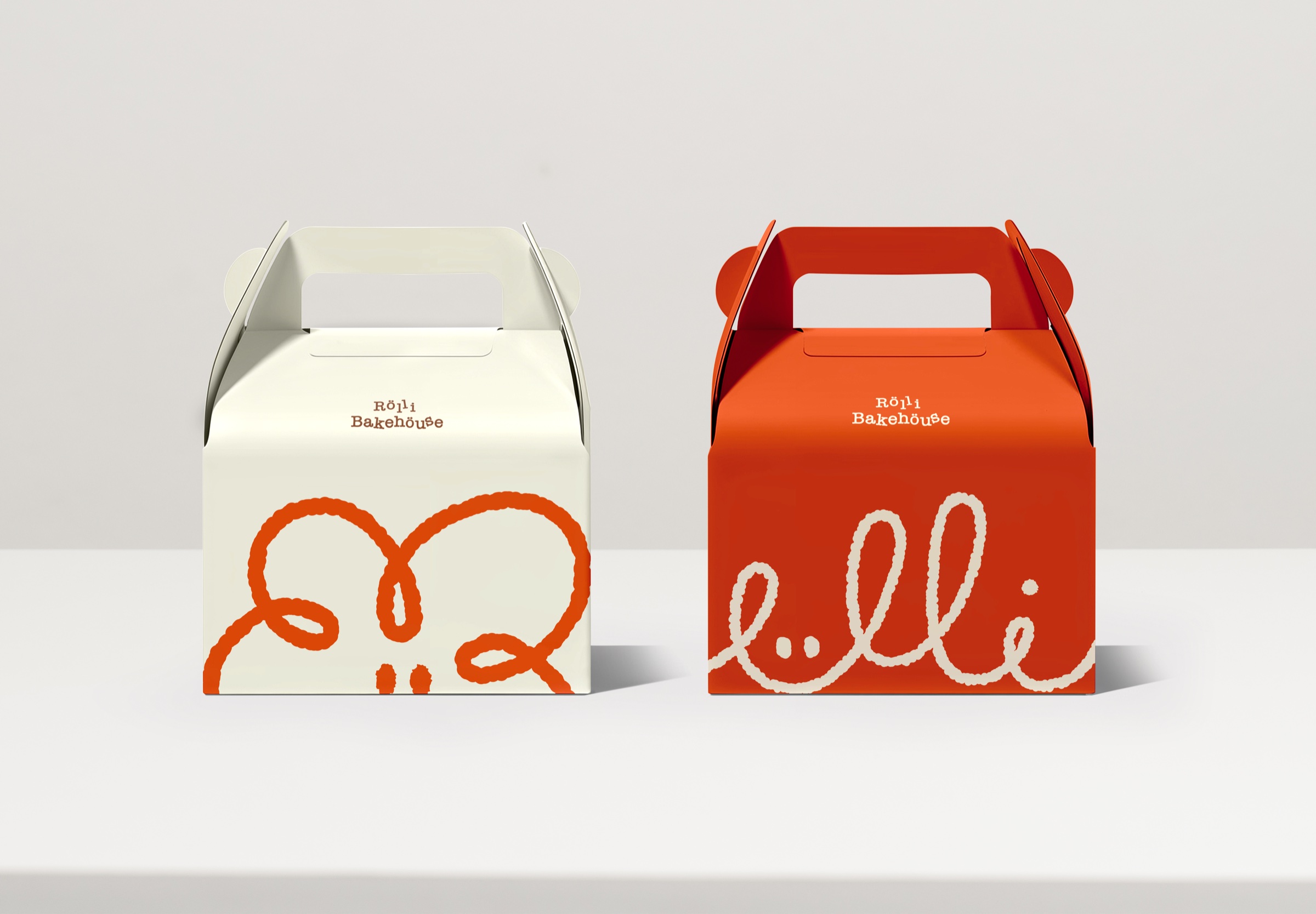 Rolli Bakehouse cake boxes in cream and orange