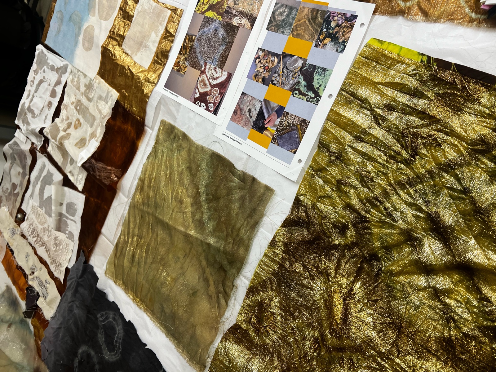 Fabric samples and printed swatches laid out before the shoot