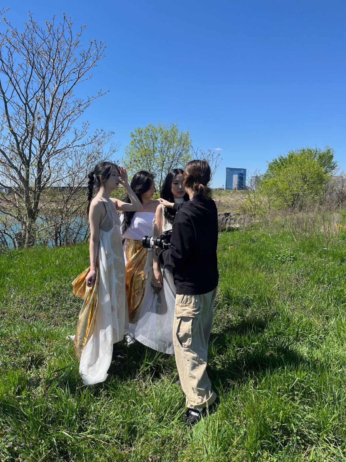 Vicky directing the three models on the grass